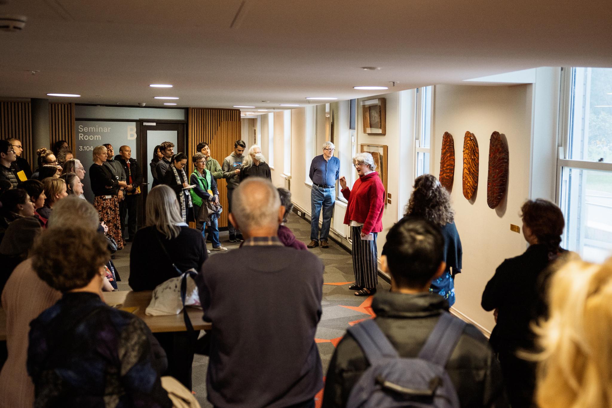 Robyn McKenzie giving a talk to a large crowd
