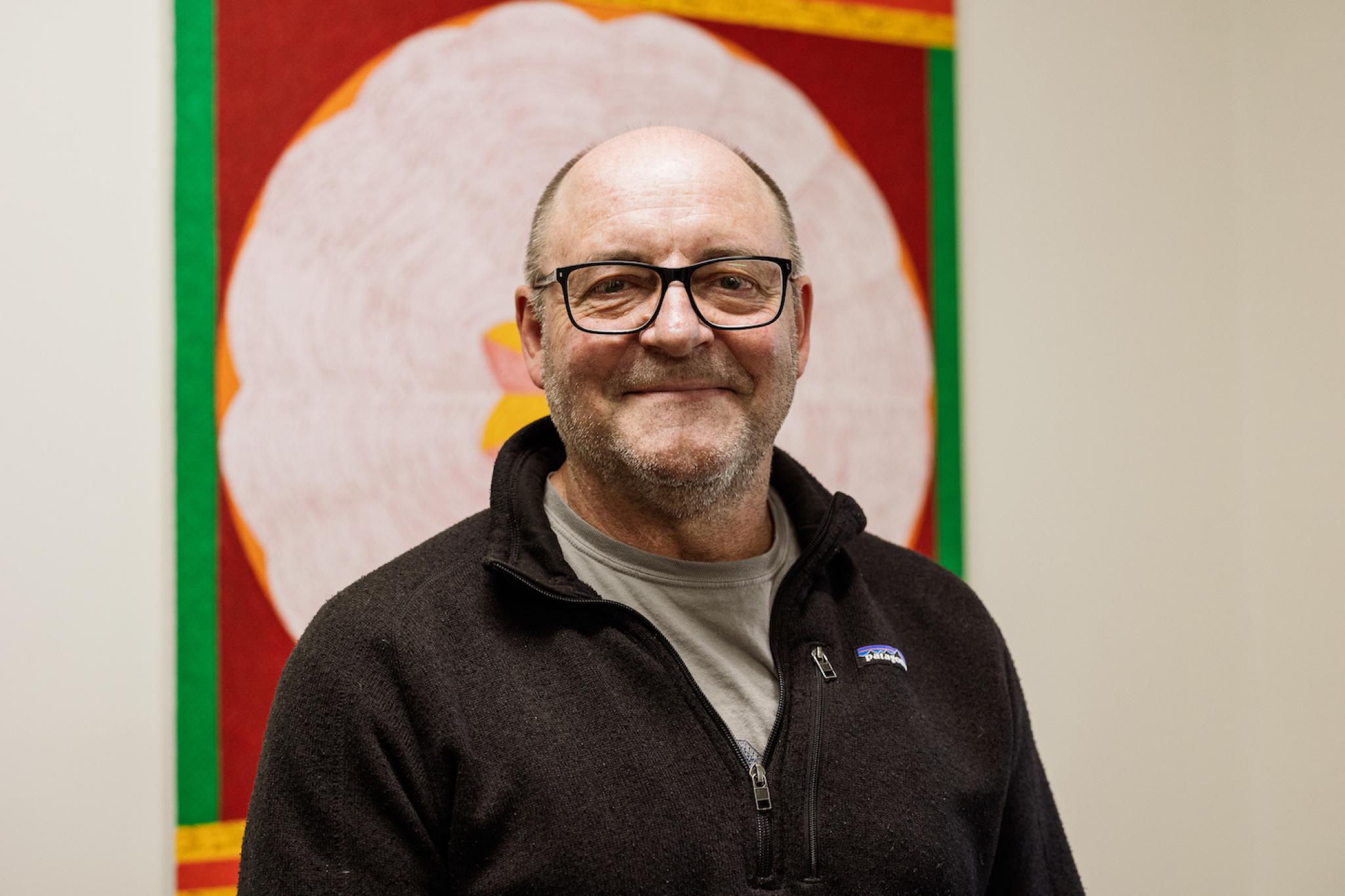 Professor Simon Haberle, Director of the School of Culture, History and Language (CHL) A profile picture of Simon Harbele standing in front of an artwork