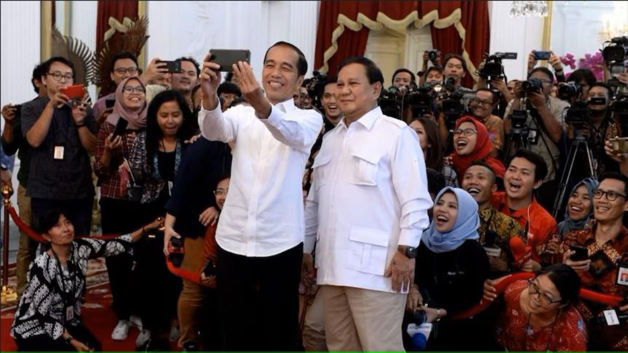 Joko Widodo's appointment of Prabowo Subianto (right) to his Cabinet has raised concerns. Twitter: @jokowi