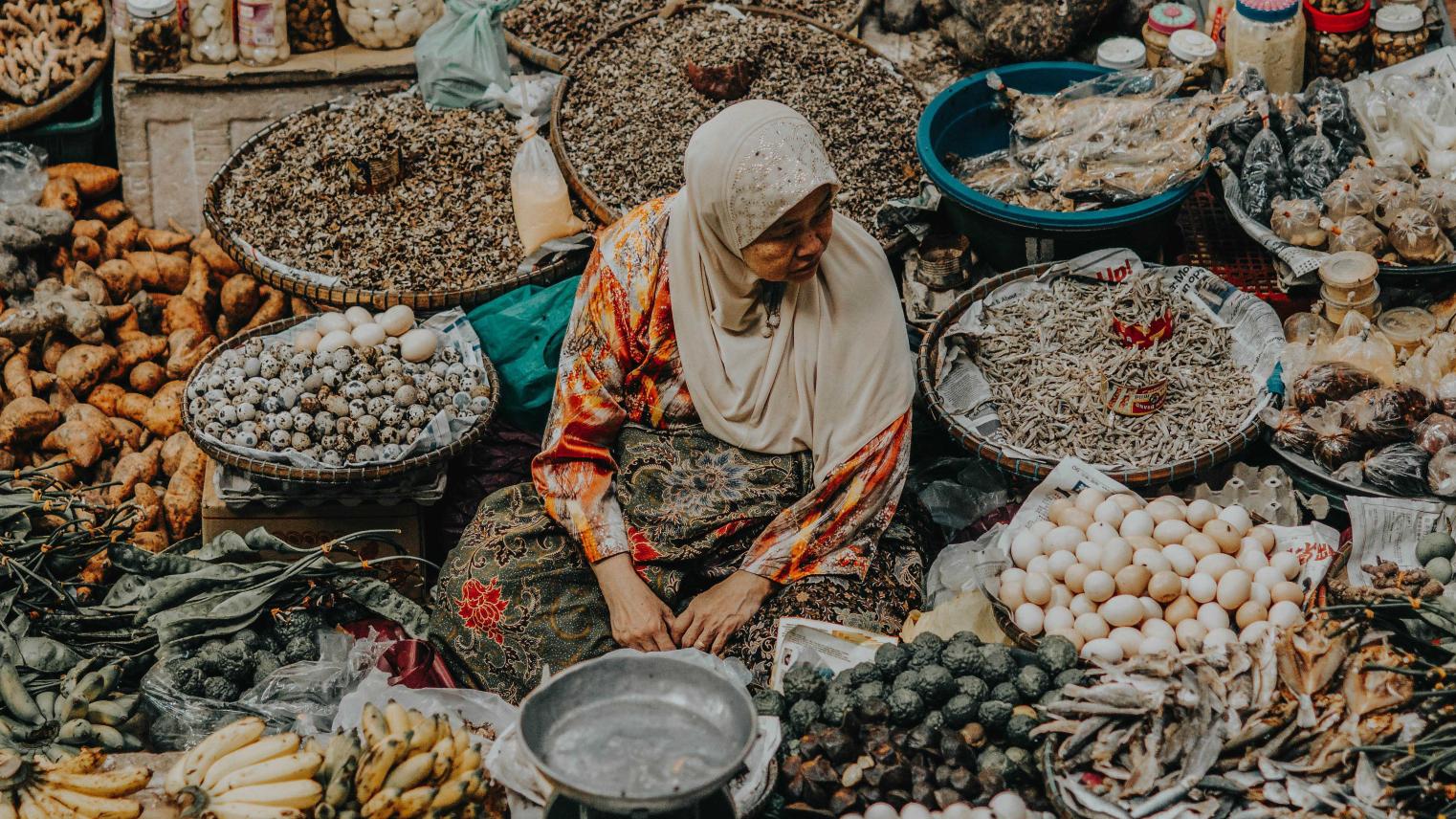 Image by Firdaus Roslan on Unsplash Old woman selling at the market in Malaysia