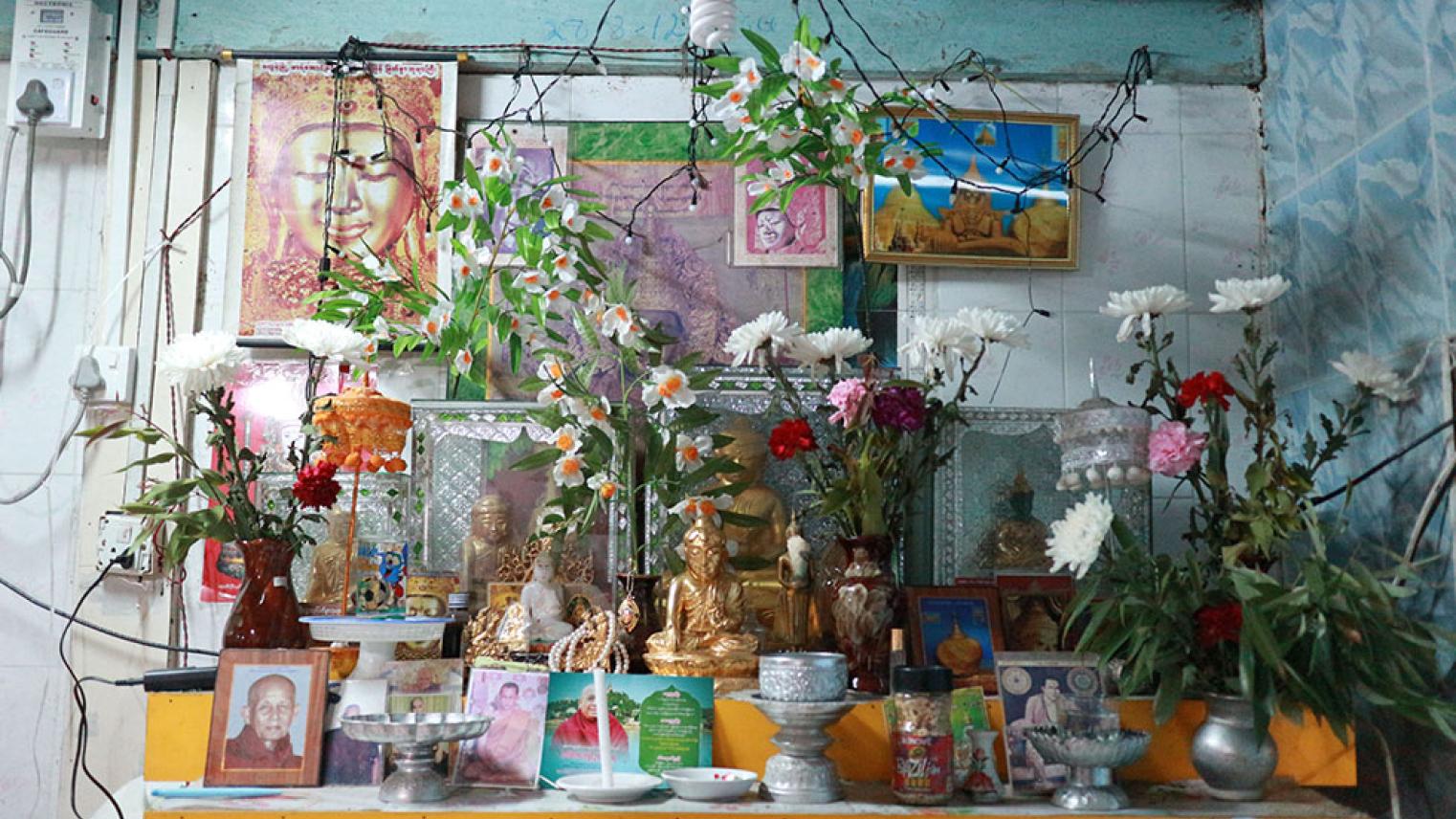 Flowers and offerings of a table in Myanmar household