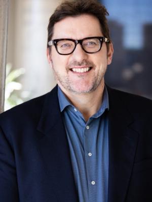 Photo of Carl, smiling.